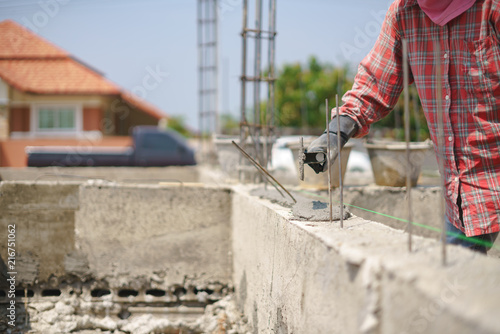 Worker labor building wall with concrete cement