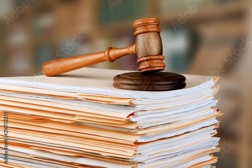 Judge hammer and documents on  background