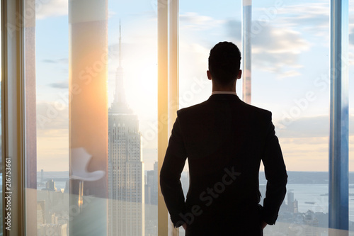 Photography Businessman looking out to the city