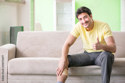 Man applying pepper Capsicum plaster to relieve pain
