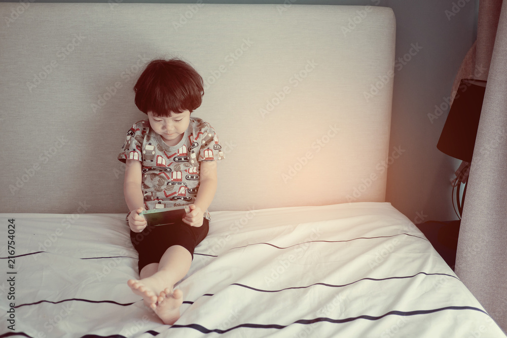 chinese child addicted phone, asian girl playing smartphone, kid use telephone, watching smartphone, watching cartoon chinese child addicted phone, asian girl playing smartphone, kid use telephone, watching smartphone, watching cartoon