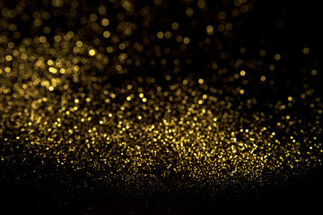 Abstract gold background. Glitter vintage lights background.