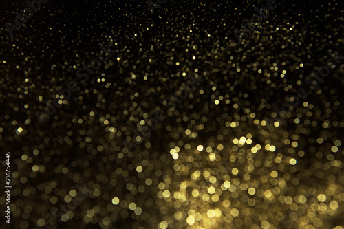 Abstract gold background. Glitter vintage lights background. photo