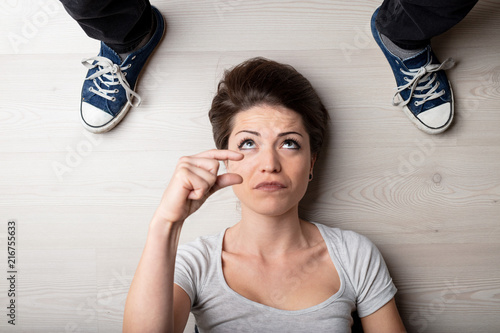 Woman making a small or short gesture photo