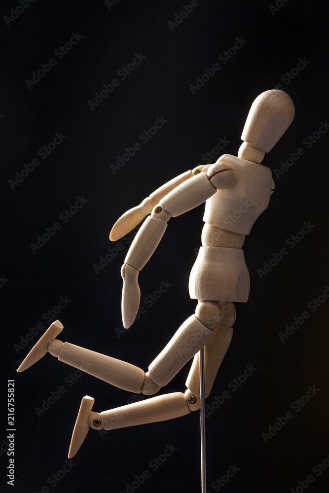 wood Mannequin, human jump, run on the black background. 