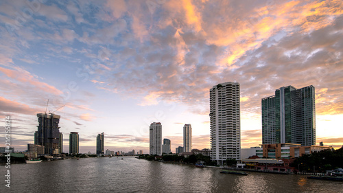 Beautiful sunset Chao Phraya River of the Metropolitan Bangkok City downtown cityscape urban , Cityscape Bangkok city Thailand