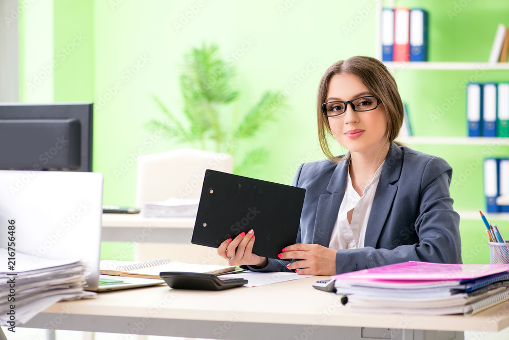 Female financial manager working in the office Female financial manager working in the office