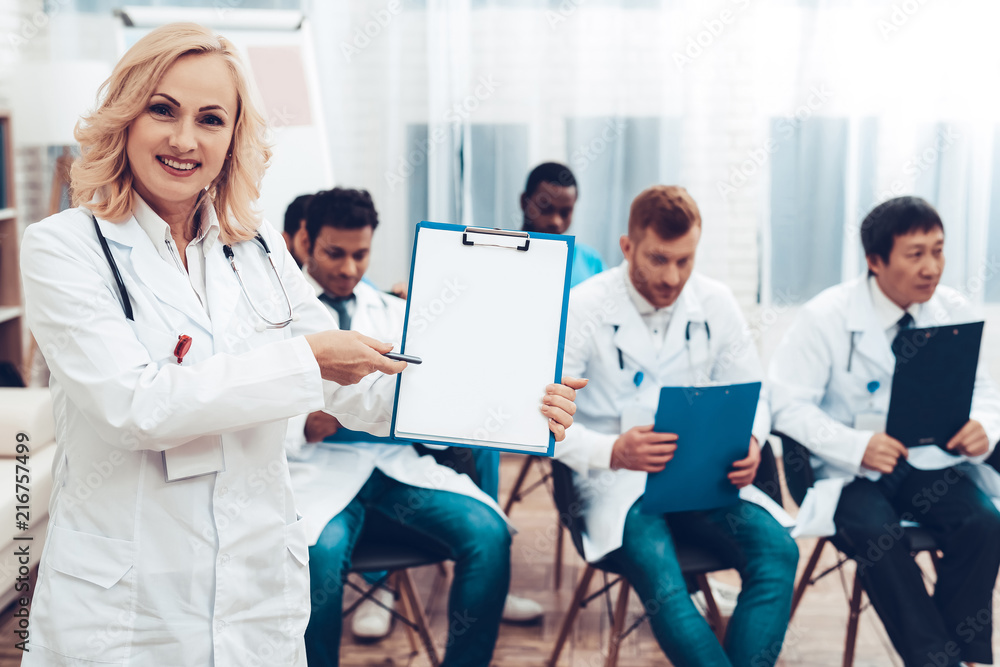 Women Doctor With Paper Notes. Diagnostic Meeting Women Doctor With Paper Notes. Diagnostic Meeting