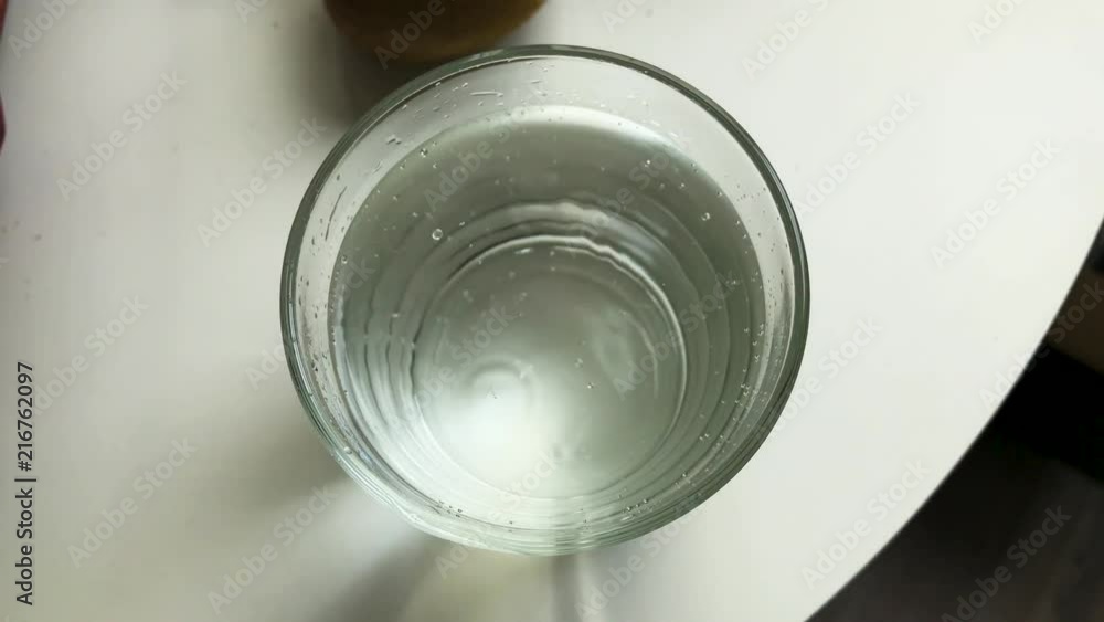 Zooming out of a water glass with sparkling water. Zooming out of a water glass with sparkling water.