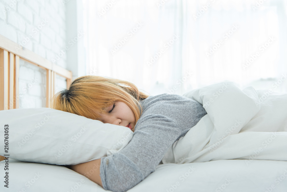 Beautiful young Asian woman sleeping in bed in the morning. Attractive asian girl use bedtime in her comfortable bedroom. Relaxation bedroom. Iifestyle asia woman at home concept. Beautiful young Asian woman sleeping in bed in the morning. Attractive asian girl use bedtime in her comfortable bedroom. Relaxation bedroom. Iifestyle asia woman at home concept.