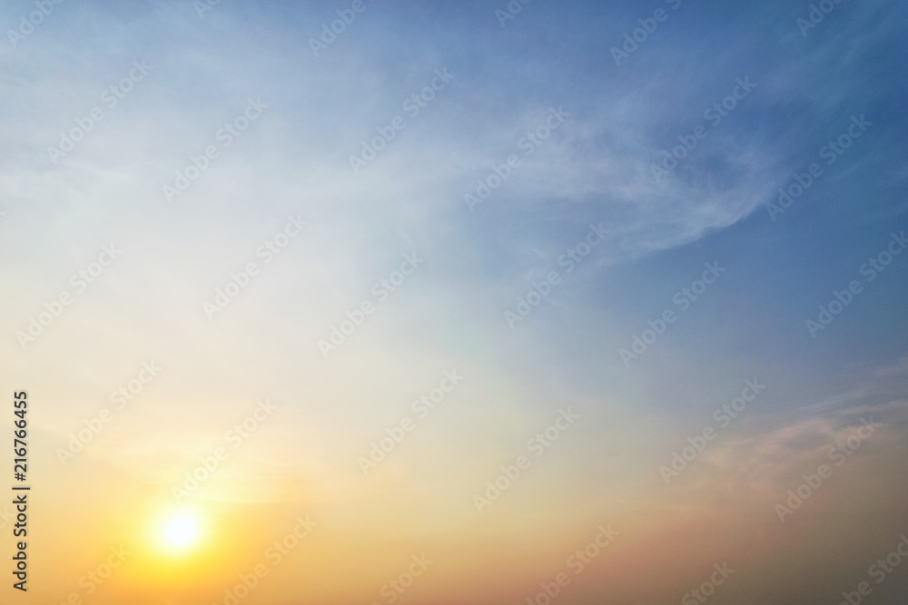 Sky blue and orange light of the sun through the clouds in the sky Sky blue and orange light of the sun through the clouds in the sky
