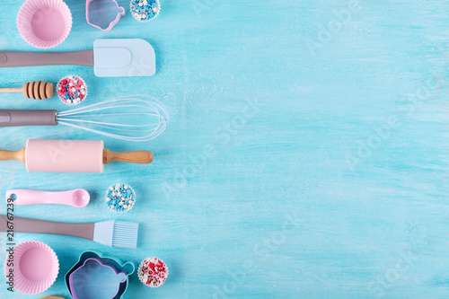 Various kitchen baking utensils. Flat lay. Top view, mockup for recipe on blue background.