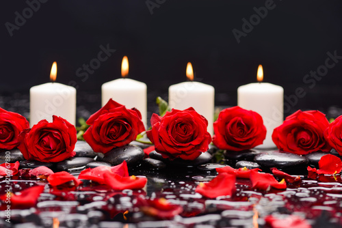 Still life with red rose  petals with candle and therapy stones   