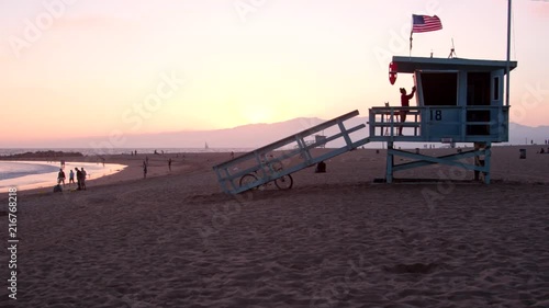 Static Shot: Lifeguard Closing Tower in Santa Monica, CA at Sunset