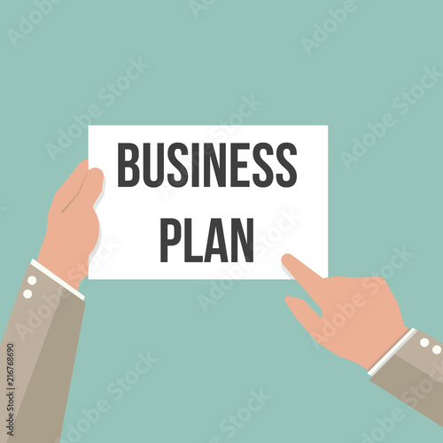 Man showing paper BUSINESS PLAN text