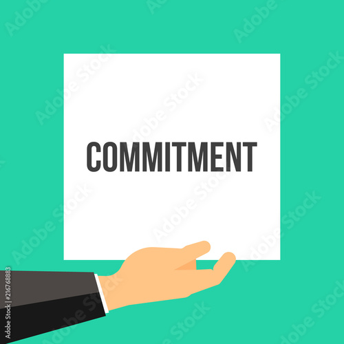Man showing paper COMMITMENT text