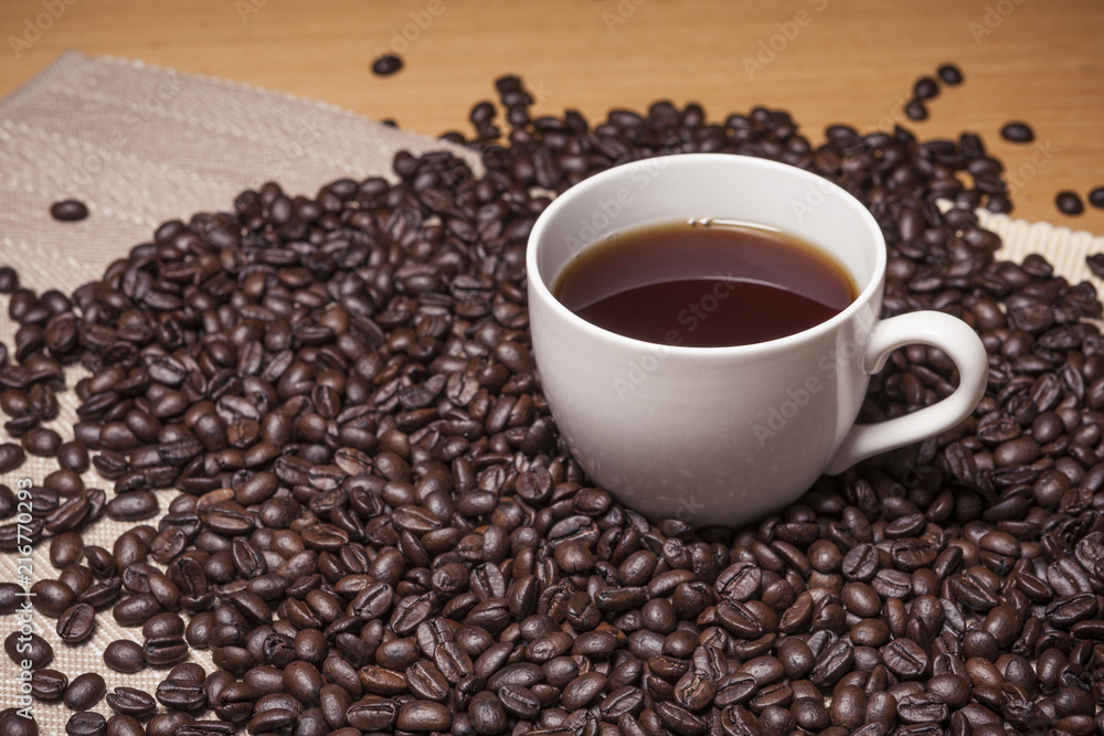 coffee bean with a white cup coffee equipment concept coffee bean with a white cup coffee equipment concept