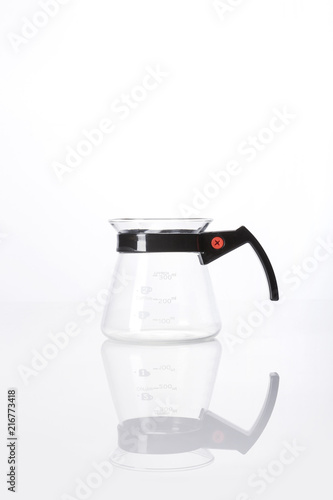 woman hand a coffee port for hand drip coffee isolated white. photo