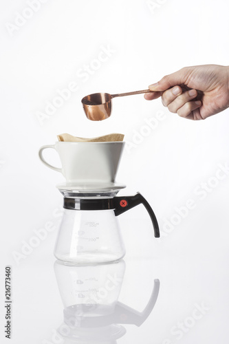 woman hand a coffee port for hand drip coffee isolated white. photo