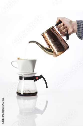 woman hand a coffee port for hand drip coffee isolated white. photo