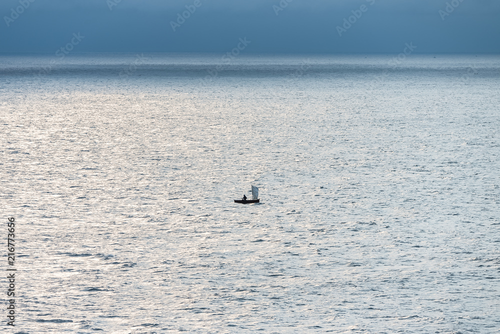 Sao Tome, fisherman on a dugout, sunrise on the Gulf of Guinea
