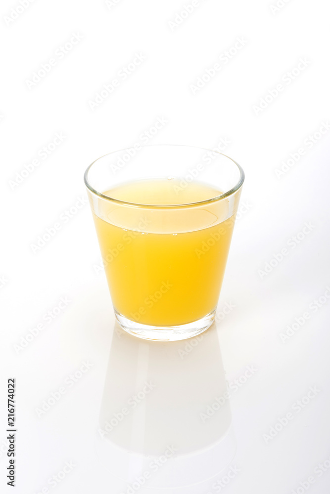 orange juice with a glass cup isolated white. orange juice with a glass cup isolated white.