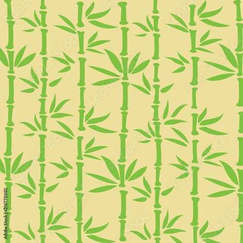 Fototapeta Naklejka Na Ścianę i Meble -  Bamboo Stems with Green Leaves on Yellow Background