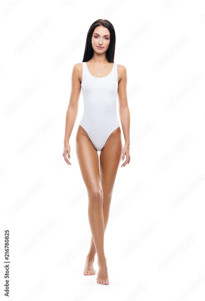Fit and sporty girl in white swimsuit. Sport, fitness, diet, weight loss and healthcare concept. Fit and sporty girl in white swimsuit. Sport, fitness, diet, weight loss and healthcare concept.
