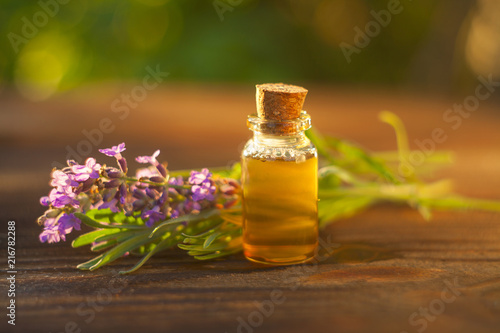 lavender essential oil in  beautiful bottle on table