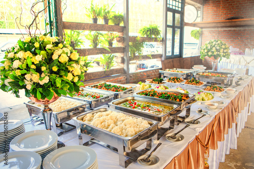 Thai buffet dinner at the beautifully arranged wedding and sunshine. photo