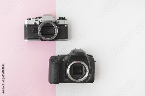 Digital versus Analog SLR Camera on Pink Background with Copyspace