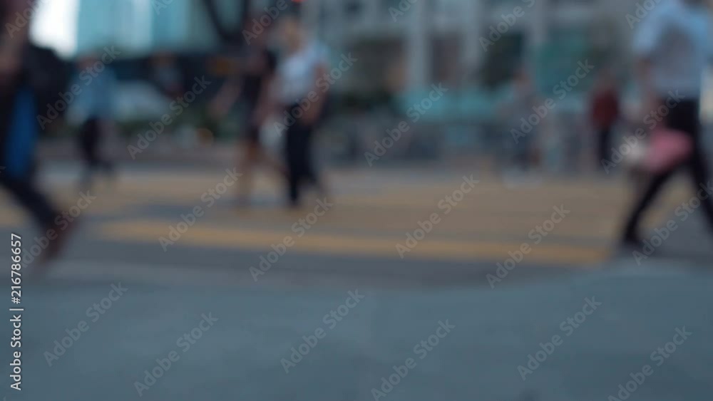 Pedestrians walking in the city. Out of focus background Pedestrians walking in the city. Out of focus background