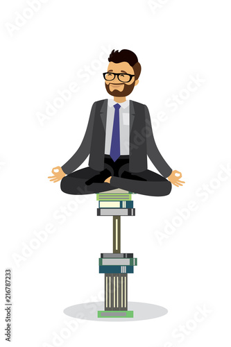 Male relax in lotus yoga pose sitting on a pile of books