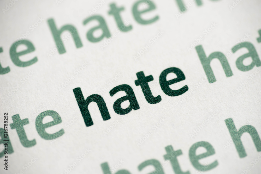 word hate printed on paper macro