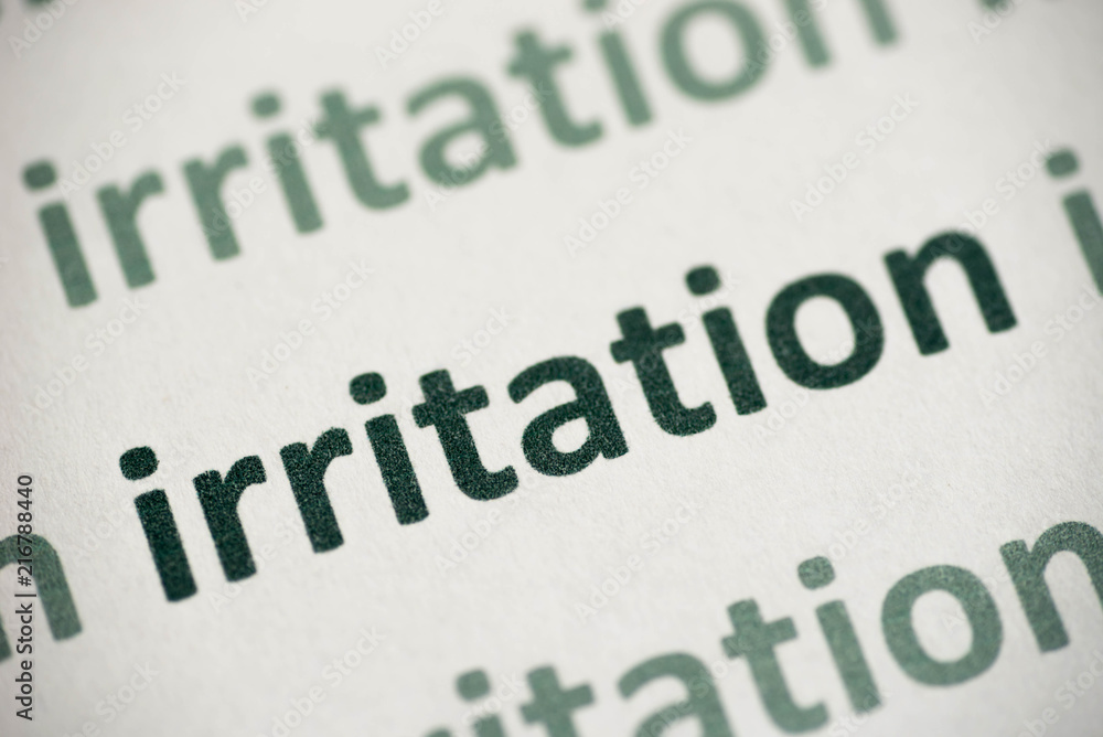 word irritation  printed on paper macro