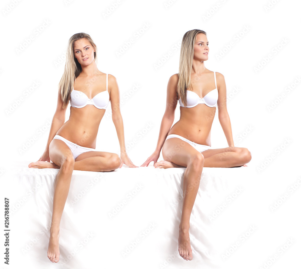 Young attractive woman in swimsuit isolated on white Young attractive woman in swimsuit isolated on white