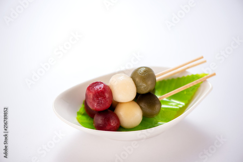 Japanese Dango dessert with 3 different color in pink(red), white, and green, recipe, hanami Dango, tsukimi Dango, copy space.