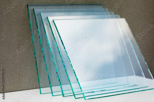 Sheets of Factory manufacturing tempered clear float glass panels cut to size photo