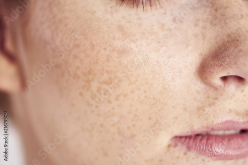 Close up of woman's face with freckles photo