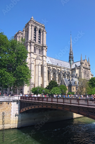 Paris, France-MAY 06, 2018: Notre Dame Cathedral or Notre-Dame de Paris-Catholic church in the center of Paris, one of the symbols of the Paris. Petit Pont - Cardinal Lustiger at the foreground