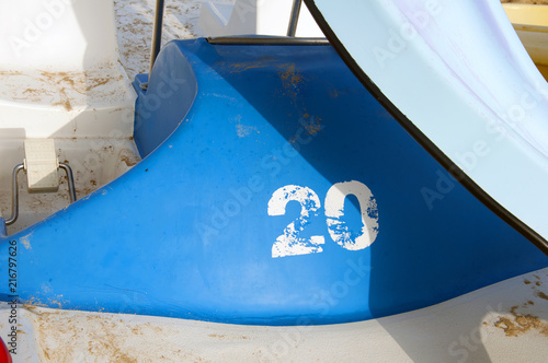 White number twenty written on the side of the pleasure boat, summer