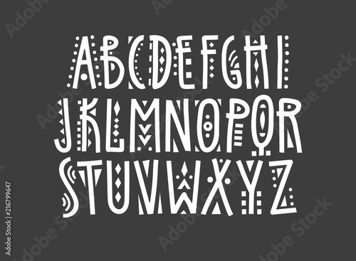 Vector uppercase ethnic alphabet, hand-drawn white letters decorated with geometric patterns on a black background.