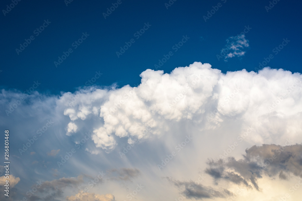 white storm cloud against a blue sky. close up white storm cloud against a blue sky. close up