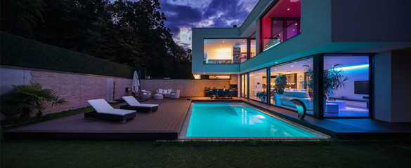Modern villa with colored led lights at night