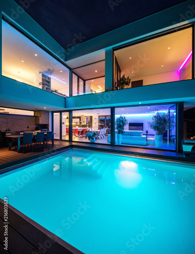 Modern villa with colored led lights at night © alexandre zveiger