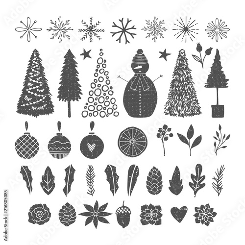 Set of hand drawn Christmas design elements. Vector isolated leaves, snowflakes and fir trees.