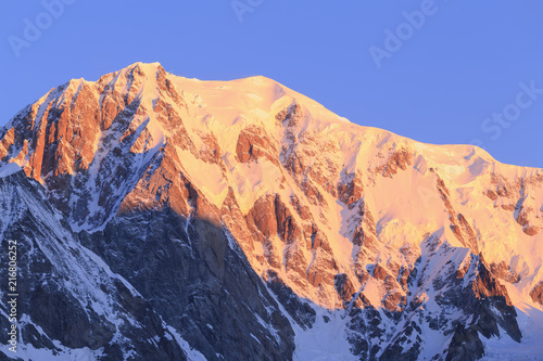 Mont Blanc illuminated by the rising sun. Ferret Valley, Courmayeur, Aosta Valley, Italy, Europe photo