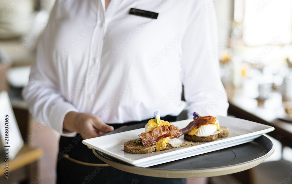 Waitress working in a hotel restaurant