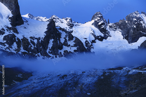 Scenic view of Forno Glacier with mountain in background photo
