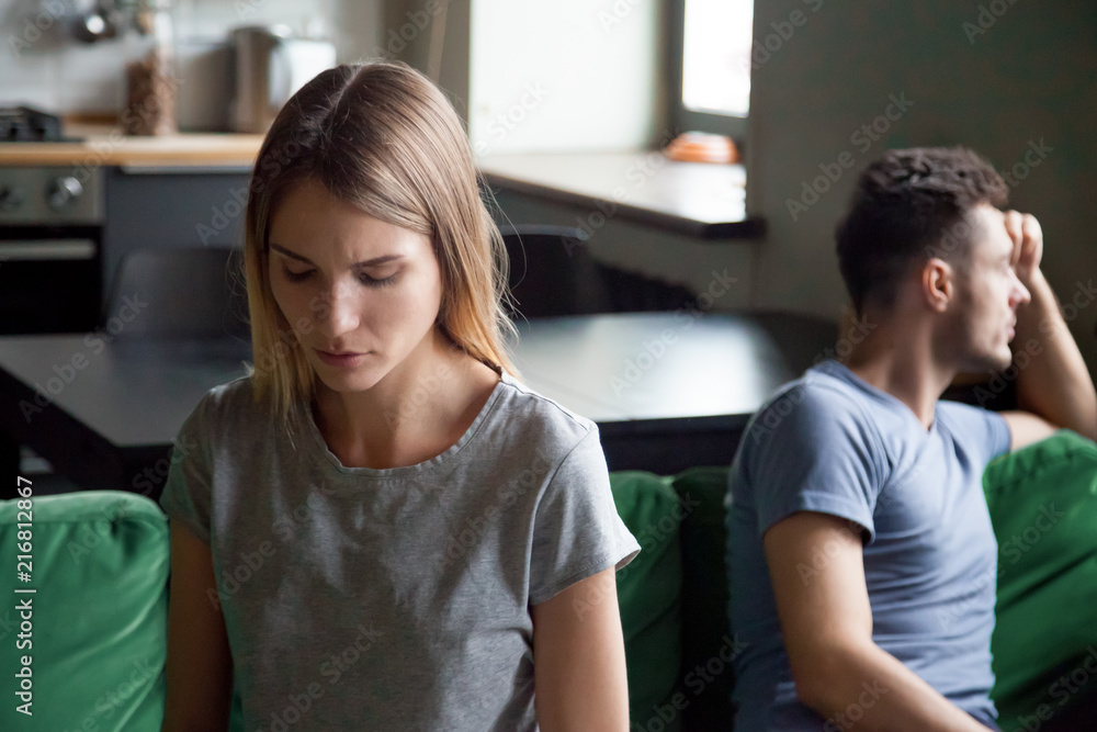Sad depressed wife feeling upset after fight with husband, disappointed frustrated millennial girlfriend and boyfriend avoiding talk, couple tired of bad relationships and marriage problems concept Sad depressed wife feeling upset after fight with husband, disappointed frustrated millennial girlfriend and boyfriend avoiding talk, couple tired of bad relationships and marriage problems concept